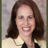 Headshot of Jennifer Mattison smiling in professional attire.