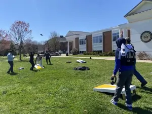 Students play corn hole outside of Franklin Hall during Student Appreciation Week 2021.