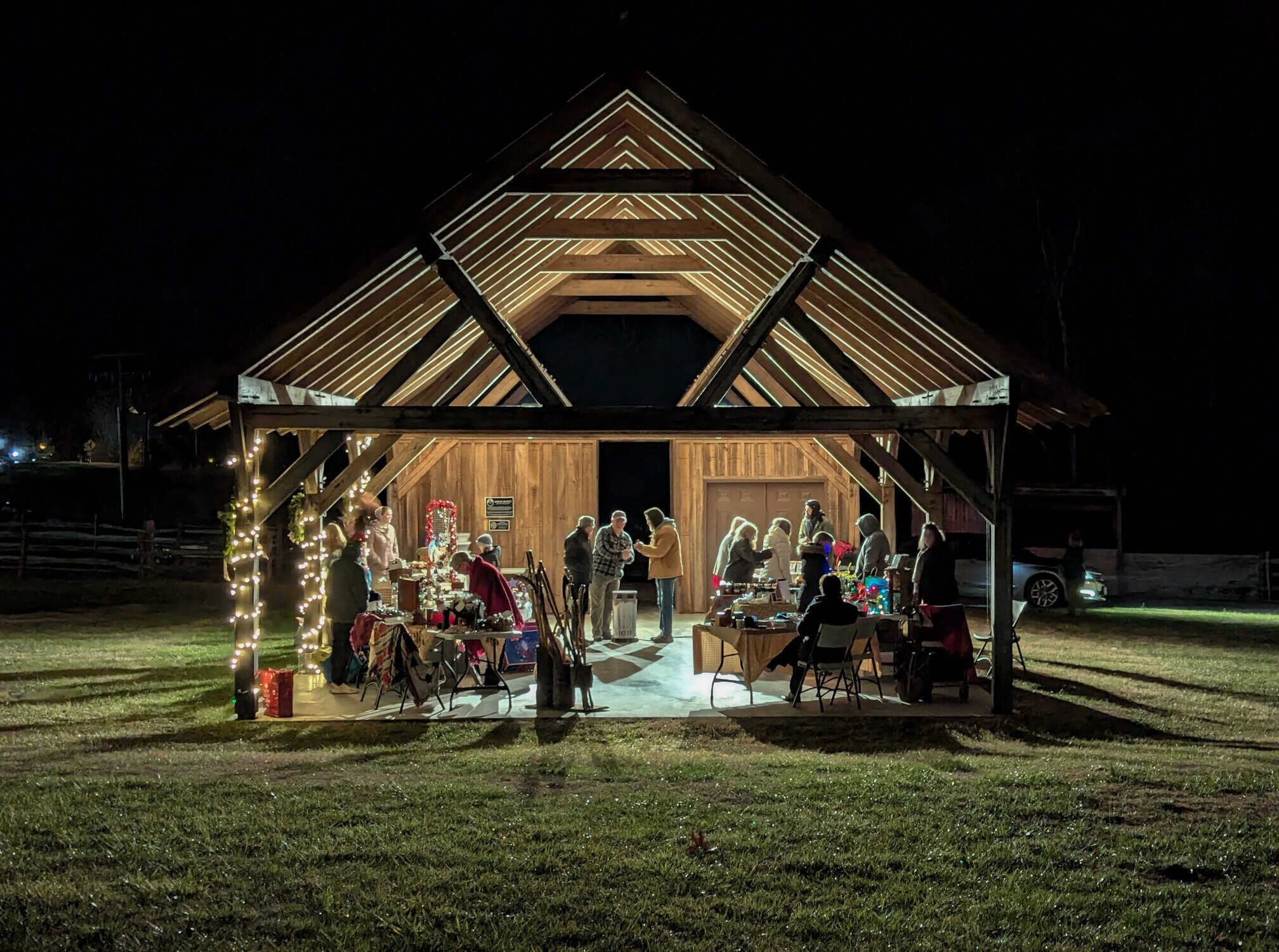 Farm museum pavilion at night light up with Christmas vendors inside