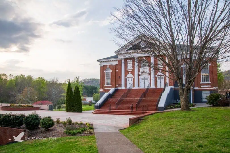Schoolfield Hall brick building with high steps and beautiful Ferrum sky