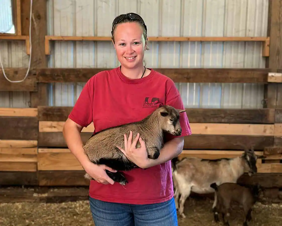 Ferrum College student holding an animal.