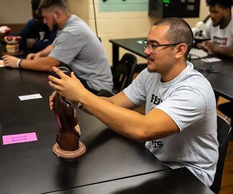 Ferrum College student working with a model in the anatomy lab
