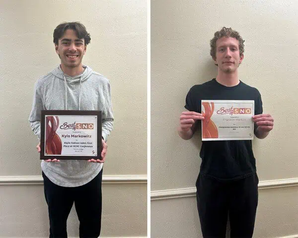 Kyle Markowitz and Franklin Melton holding their awards.