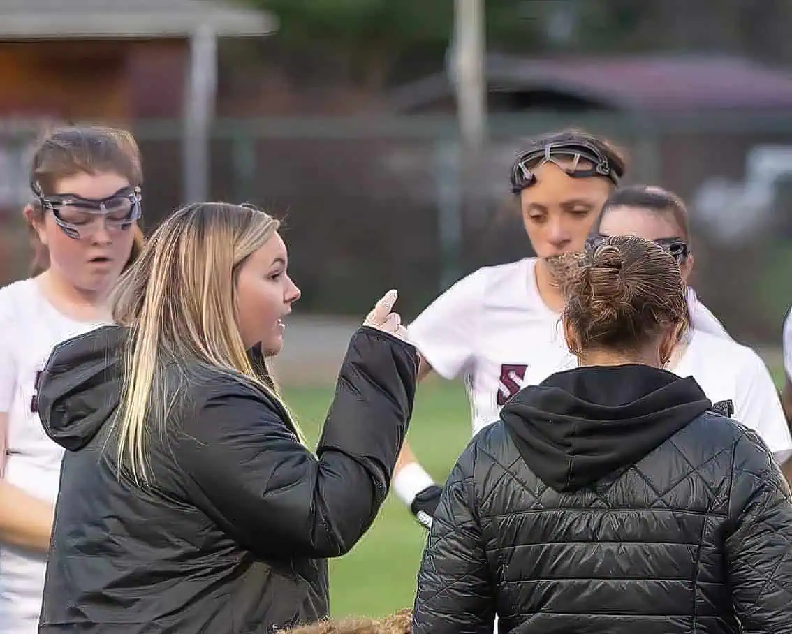Ferrum alumna Carly Coyle is coaching a group of women lacrosse players