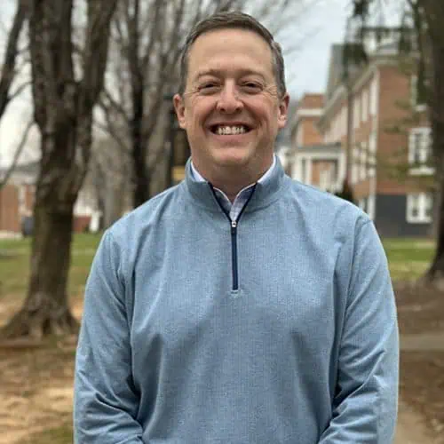 Headshot of Ferrum College staff John Devault standing outside on campus.
